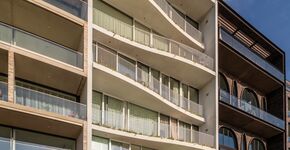 Golvende prefab gevel voor Lofts aan de Amstel